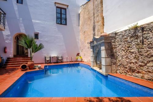 a swimming pool in the middle of a building at Calergi Residence - Holidays in Crete in Atsipopoulo
