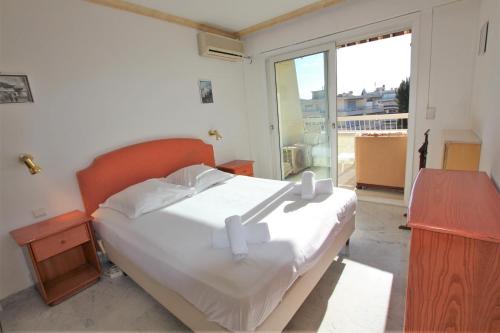 Posteľ alebo postele v izbe v ubytovaní Appartement 80 m2 au centre-ville de Cannes