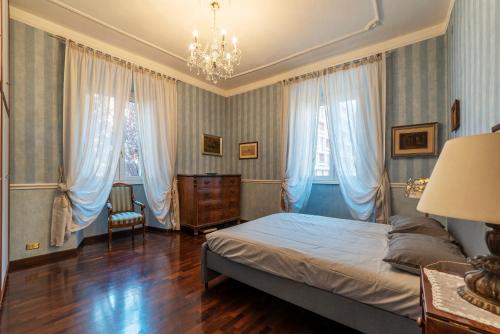 A bed or beds in a room at Castel Sant'Angelo Cozy Apartment