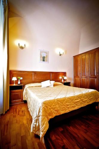 Llit o llits en una habitació de Relais Cavour