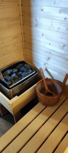 a tray and a pan of food in a sauna at To Je To apartamenty in Maniowy