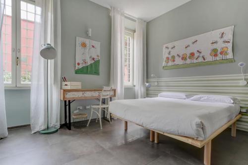 a bedroom with a bed and a desk in it at CAPO D'AFRICA 30 - COLOSSEO in Rome