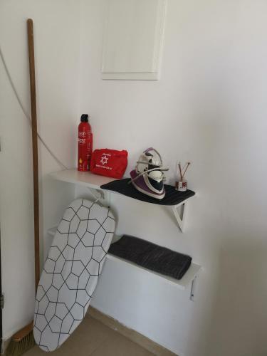 a room with a white wall with a shelf at נופש מול הכנרת Vacation in front of the Sea Galilee in Tiberias