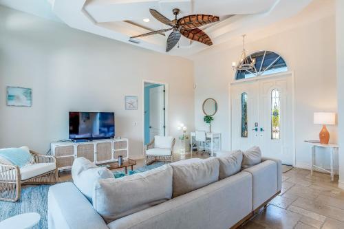 a living room with a couch and a tv at Marco Paradise in Marco Island