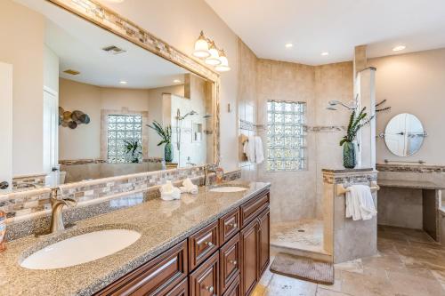 a bathroom with two sinks and a large mirror at Marco Paradise in Marco Island