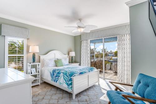 a bedroom with a bed and a window at Marco Paradise in Marco Island