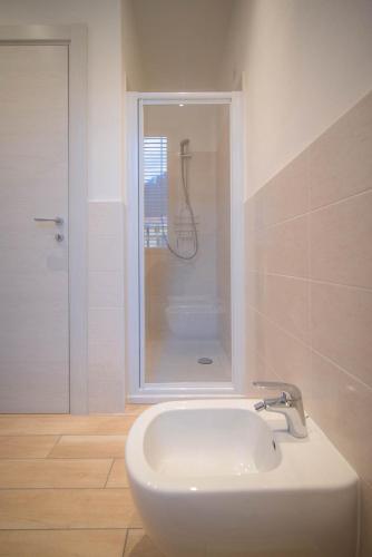 a bathroom with a sink and a shower at Comonfive Apartments in Como