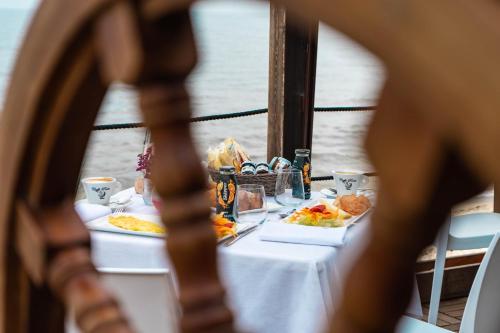 a table with plates of food on it at La Locanda del Mare in Valledoria
