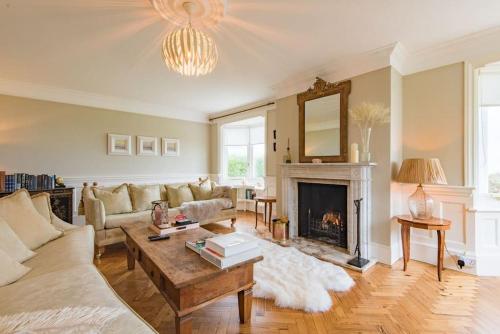 a living room with a couch and a fireplace at Victory at Cliffe in Kingsdown