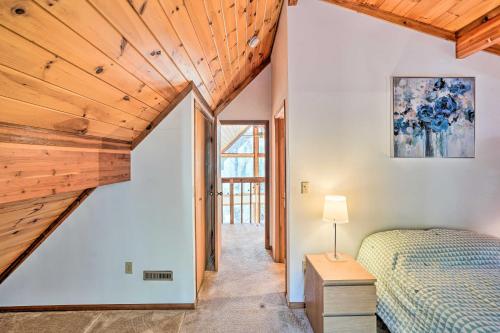 a bedroom with a bed and wooden ceilings at Berkshires Cabin 2 Mi to Appalachian Trail! in Otis