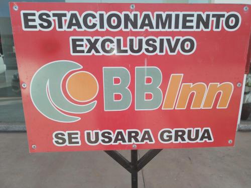 a red sign that saysinternational cuisine biliary bilimin at BB INN in Nuevo Vallarta 