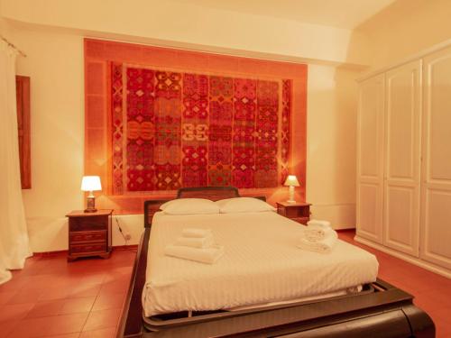 En eller flere senger på et rom på Apartment San Felice by Interhome