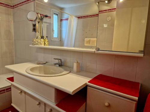 a bathroom with a sink and a mirror at Casa Melina 2 in Tremezzo