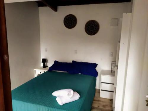 Ένα ή περισσότερα κρεβάτια σε δωμάτιο στο Tranquilidade e linda vista da lagoa