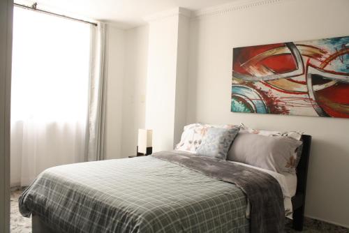 Ένα ή περισσότερα κρεβάτια σε δωμάτιο στο Apartahotel Kelly