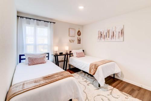 a bedroom with two beds and a window at Family-Friendly Bellmead Home about 6 Mi to Waco in Bellmead