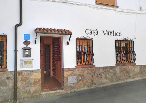 a building with a door and windows on a street at Casa Vaélico in Arenas de San Pedro