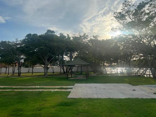 a park with a gazebo in the grass at Chalé em Barreirinhas in Barreirinhas