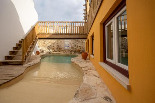 a swimming pool in the middle of a building at Villa Galega in Santa Cruz