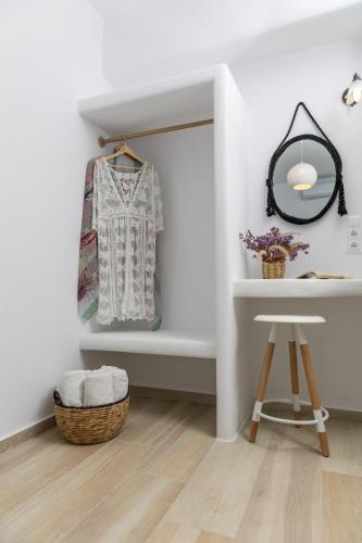 a dressing room with a mirror and a stool at Marine Dream in Plaka