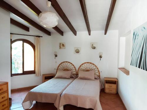 a bedroom with a bed in a room at Villa Gaviota in Benissa