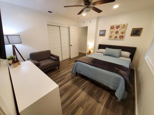 a bedroom with a bed and a living room at Amazing Oasis 3 in Clovis 4 Bedrooms in Clovis