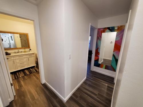 a bathroom with a sink and a mirror at Amazing Oasis 3 in Clovis 4 Bedrooms in Clovis