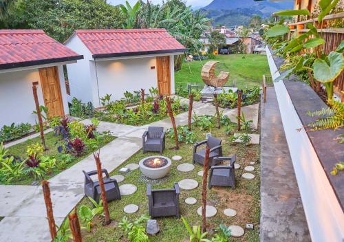 a garden with chairs in the middle of a yard at Panorama Salento by DOT Boutique in Salento