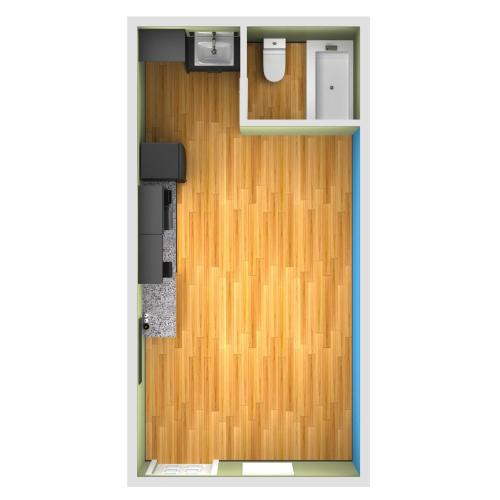 una puerta que conduce a una habitación con suelo de madera en Royal Extended Stay Hotel, en Selma