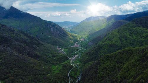 an aerial view of a valley in the mountains at Case vacanze in graziosa borgata alpina in Villaretto