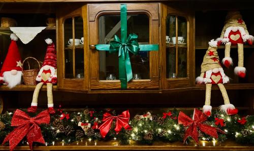 a group of christmas ornaments on a shelf at Karczma Leśniczanka in Wielbark