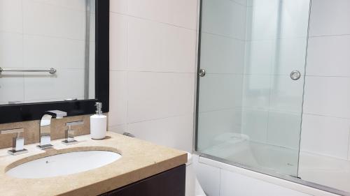 a bathroom with a sink and a shower at GL Apts, rent Upper Pardo Miraflores - Suite 1 Hab in Lima