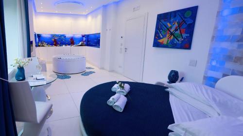 a room with a teddy bear sitting on a table at Aquaboutique Wellness&Spa in Vietri sul Mare