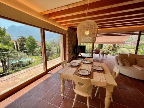 a living room with a table and a couch at Da Gianni e Villa Annamaria in Arco