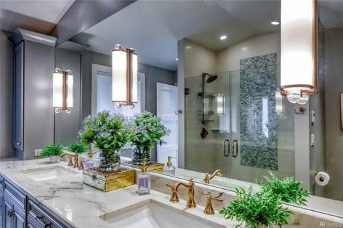 a bathroom with two sinks and a shower at Oasis By The Sea in Port Hadlock