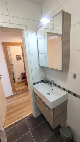 a bathroom with a sink and a mirror at Fewo Gabriela Allgäu in Immenstadt im Allgäu