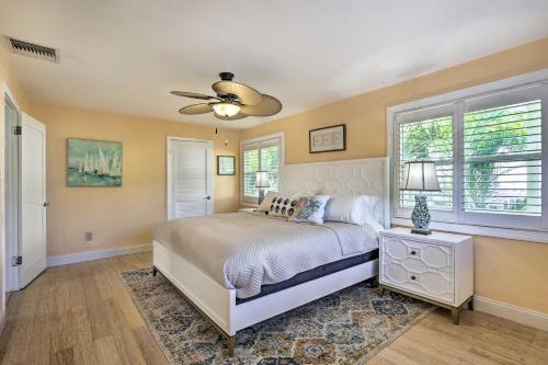 een slaapkamer met een bed en een plafondventilator bij Key Largo Paradise with Heated Pool and Hot Tub! in Key Largo