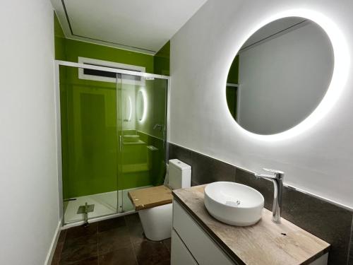 a bathroom with a sink and a mirror at EL AMANTE in Consuegra