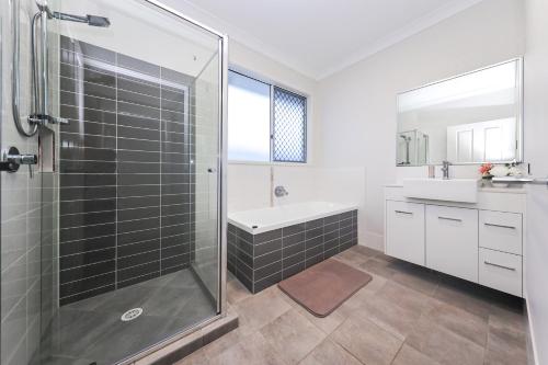 a bathroom with a shower and a sink at Redcliffe in Redcliffe