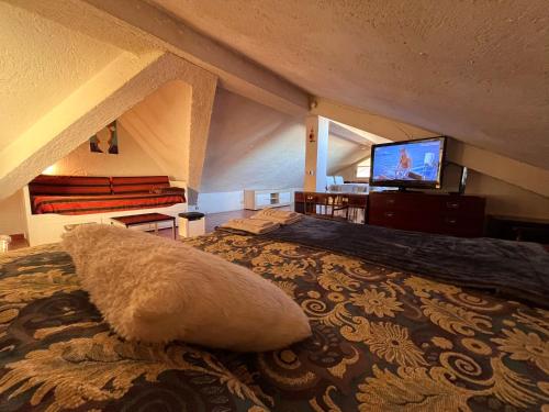 Ένα ή περισσότερα κρεβάτια σε δωμάτιο στο Attico a Roma