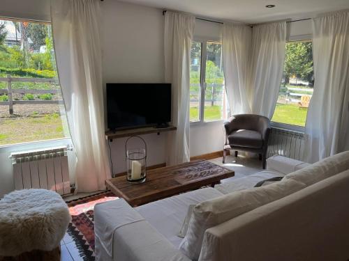 Posezení v ubytování La Pampita en Villa Arelauquen