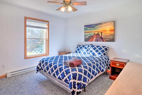a bedroom with a bed and a ceiling fan at Near Hiking Lakefront Albrightsville Home with Deck in Albrightsville