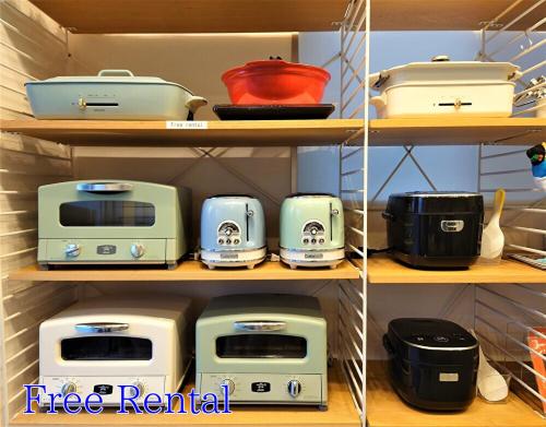 a shelf with several appliances on it at GLANZ KEI Kyoto Station in Kyoto
