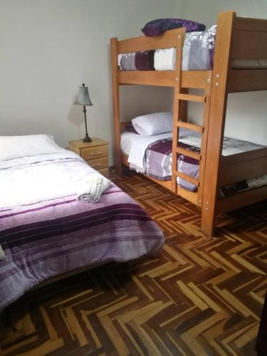 Cama o camas de una habitación en Hospedaje Las Lilas Surco