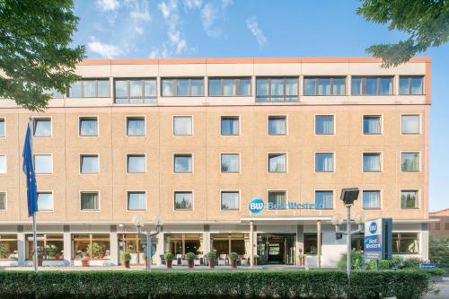 a large brick building with a hospital at Best Western Hotel Hamburg International in Hamburg