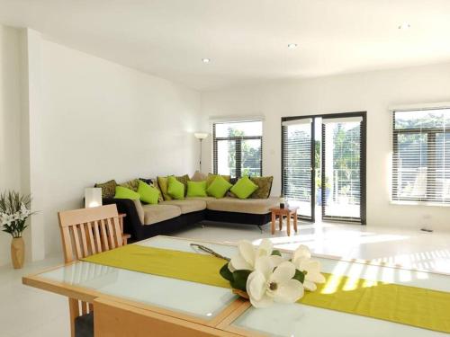 a living room with a couch and a table at The Willow Apartment in Clifton Falls