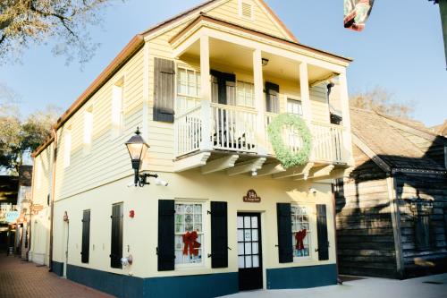 a building with a balcony on top of it at 14 1/2 St. George Street in St. Augustine