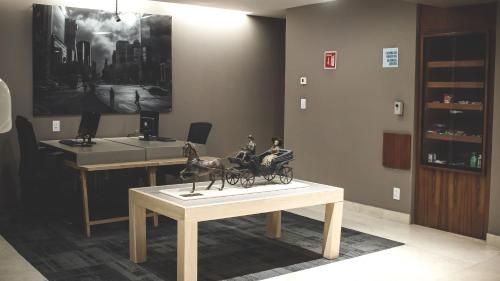 a statue of two people riding in a carriage on a table at Holiday Inn Express Mexico Reforma by IHG in Mexico City
