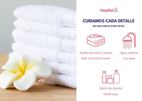 a bundle of towels next to a pile of towels at Casa radiante en San Miguel de Allende in San Miguel de Allende