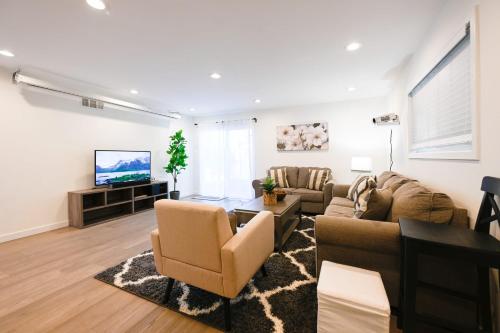 a living room with a couch and a table at @ Marbella Lane - Exquisite Home 3BR in Sunnyvale